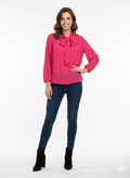 Blusa de gasa rosa con lazada